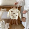 A stylish bow round-neck top, flared pants and cute bag set for baby girls in autumn and winter 2025