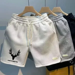 Men's summer sports shorts casual and fashionable solid color wave pattern sports shorts with drawstring hollow quick drying gym