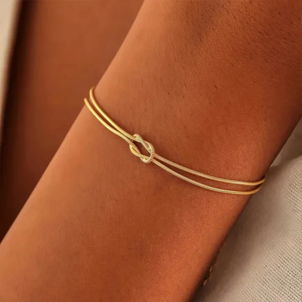 eManco Gold & Silver Stainless Steel Art Deco Knot Slim Snake Chain Bracelet Couple Social Art Jewelry - Image 4