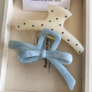 New Spring/Summer design, large polka dot hair clip with bow at the back of the head, versatile hair accessory.