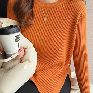 2026 Autumn Winter Slim‑Fit Structured Shoulder Gold Button Decor Sweater French Style O-Neck Women Pullover Side‑Slit Knit Top