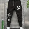 XX Eyes Smiley Sweatpants, Unisex Drawstring Joggers Dripping Face Graffiti Print Cuffed Side Pocket Streetwear Trousers